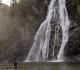 Man standing at Virgin Falls, BC