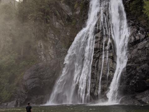 Man standing at Virgin Falls, BC