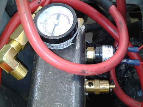 manifold with gauge, blow off valve, pressure switch.
