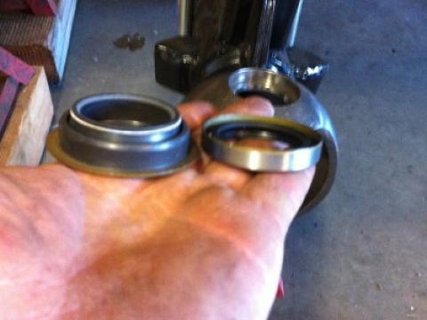 Beefier axle seal next to stock on left